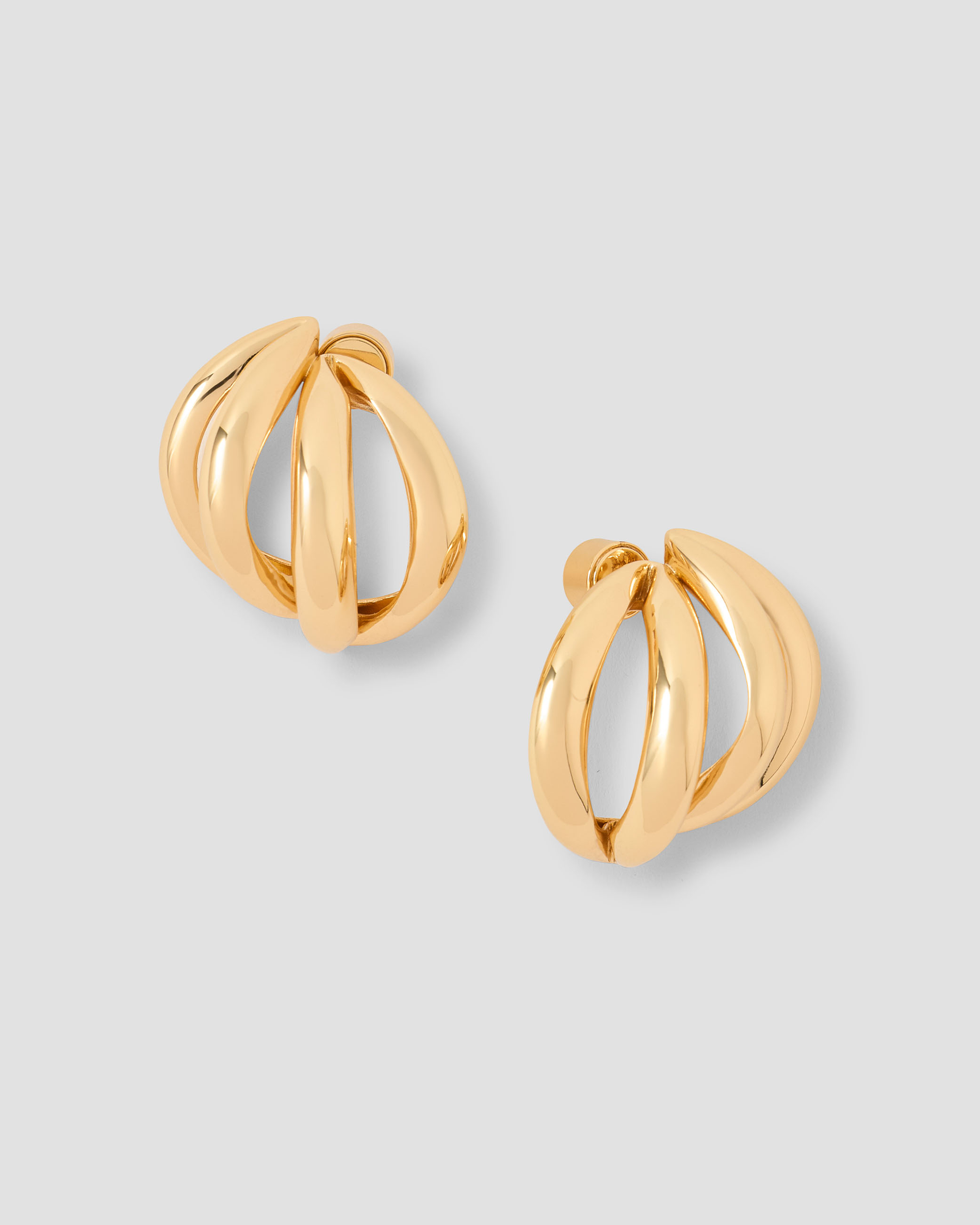 gold thin knot cuff on grey background